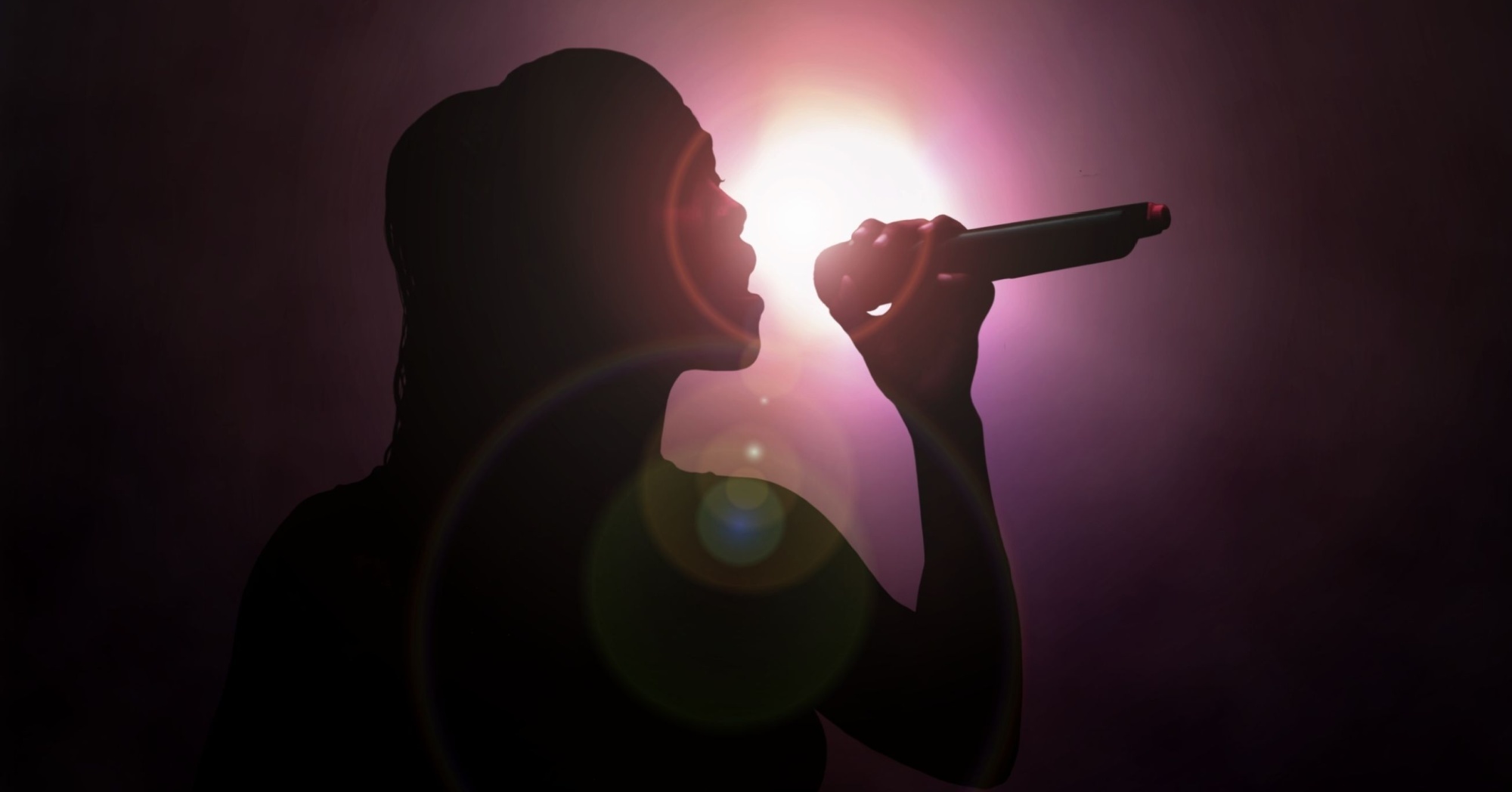 A woman singing with a microphone
