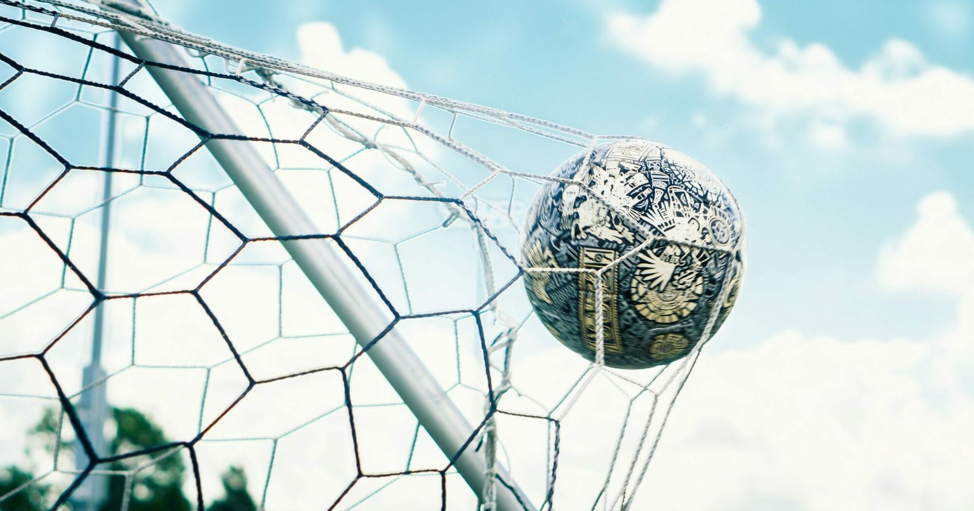 Football ball crossing the net
