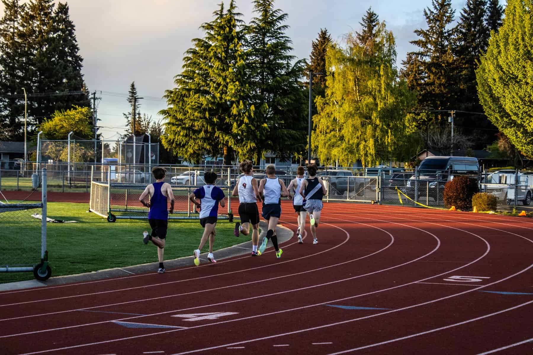 Athletes running on a race track