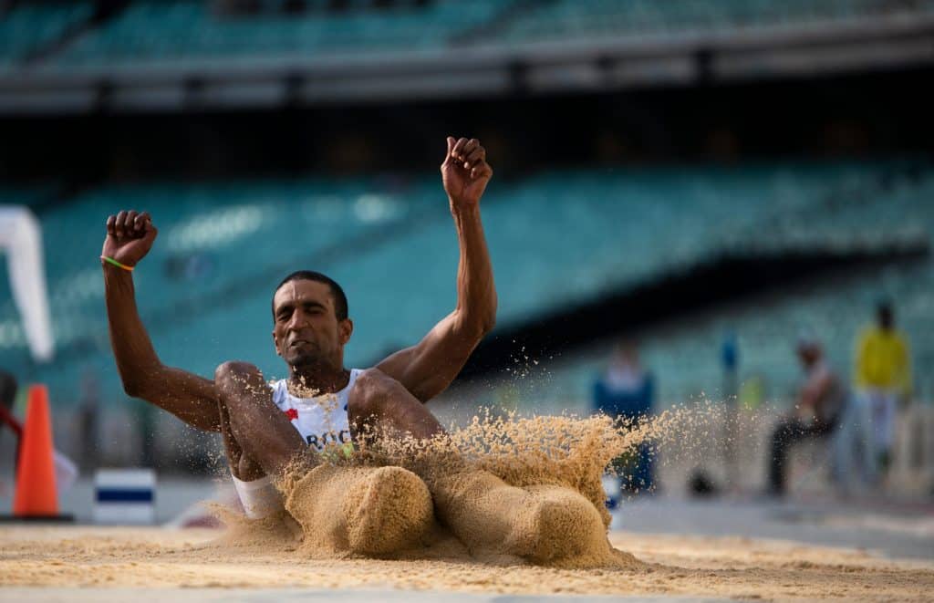 Athlete during Long Jump into Sand