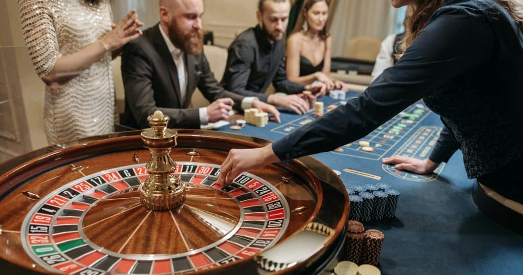 people playing roulette at a table