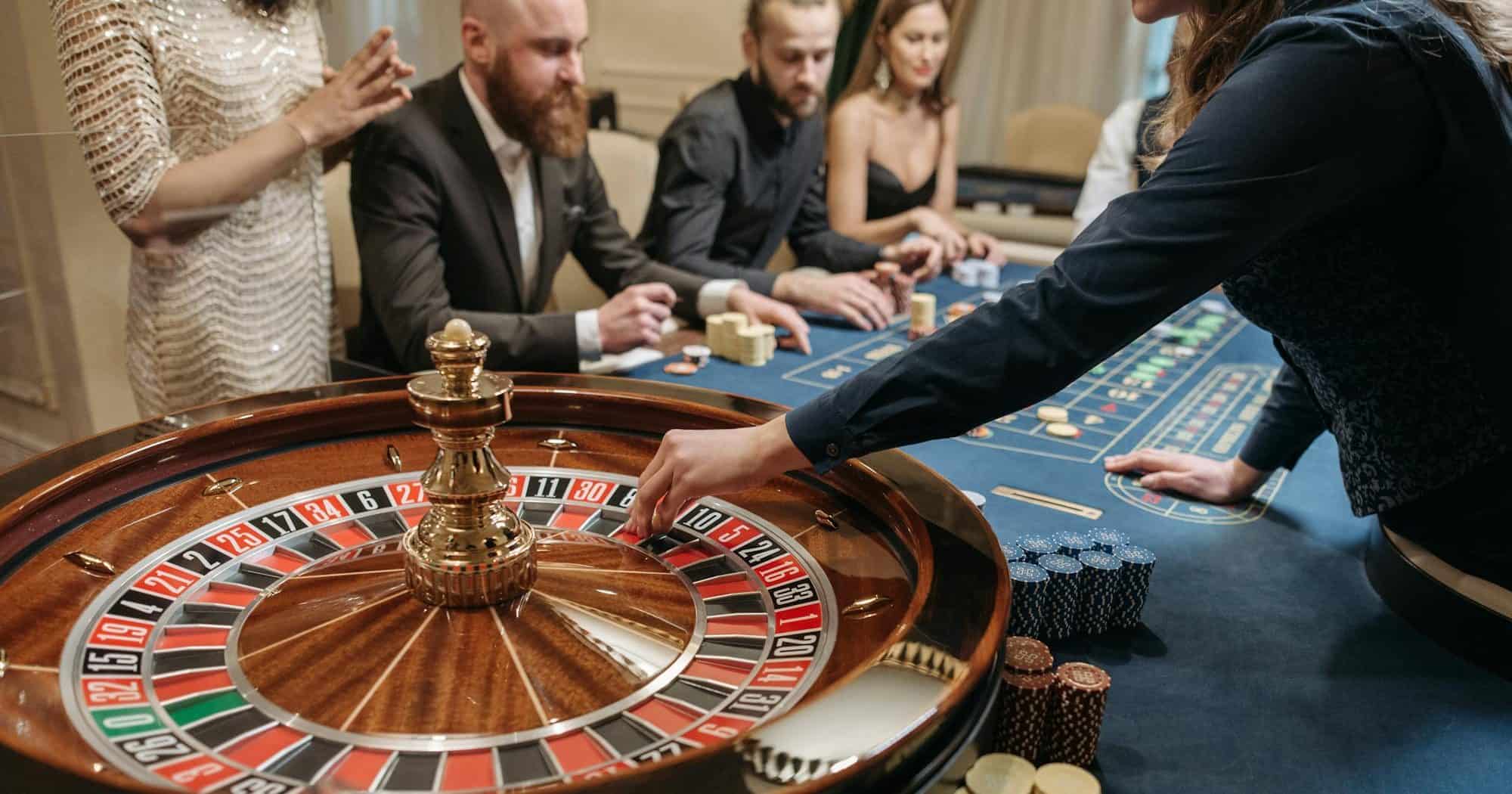 people playing roulette at a table