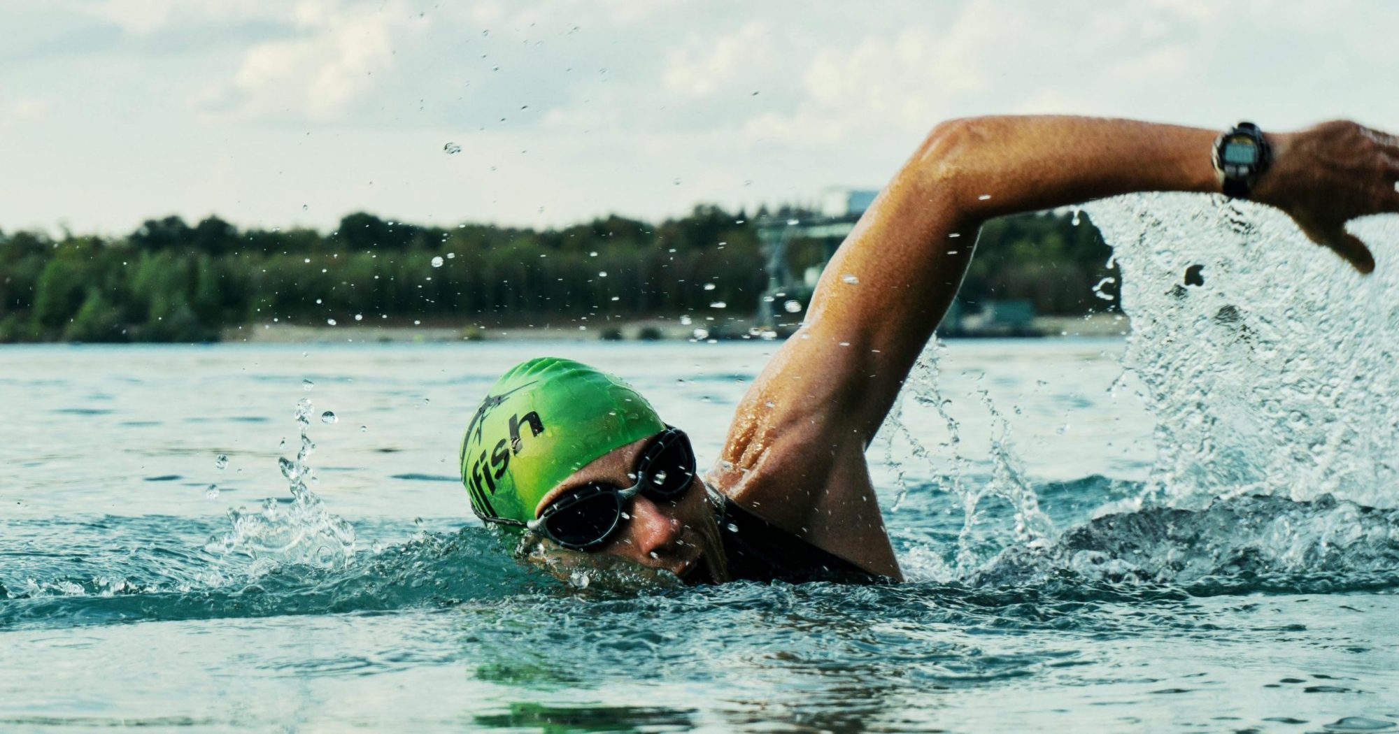 Person Swimming on Body of Water