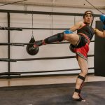 Woman kicking in a ring