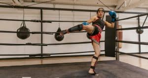 Woman kicking in a ring