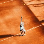 Man preparing to serve a tennis ball
