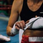 Fighter wrapping her hands before the fight