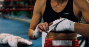 Fighter wrapping her hands before the fight