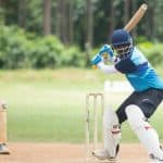 Cricket player hitting the ball