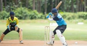 Cricket player hitting the ball