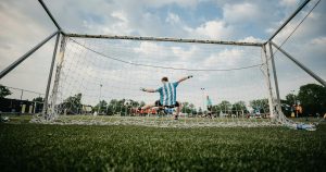 Football goalie stopping a shot