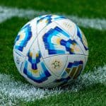 Football ball in the fields corner