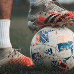 Football player with football ball