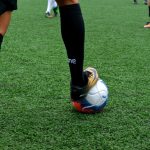 Man playing football with a football ball