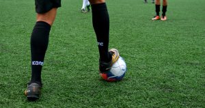 Man playing football with a football ball