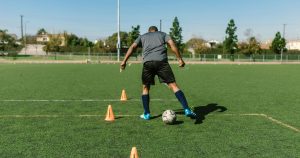 Man dribbling the football ball
