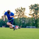 Football player doing trick on the field