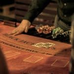 Croupier on the poker table