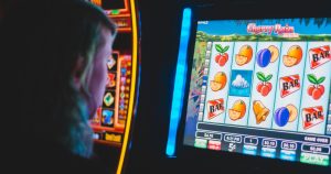 Man sitting on a slot machine