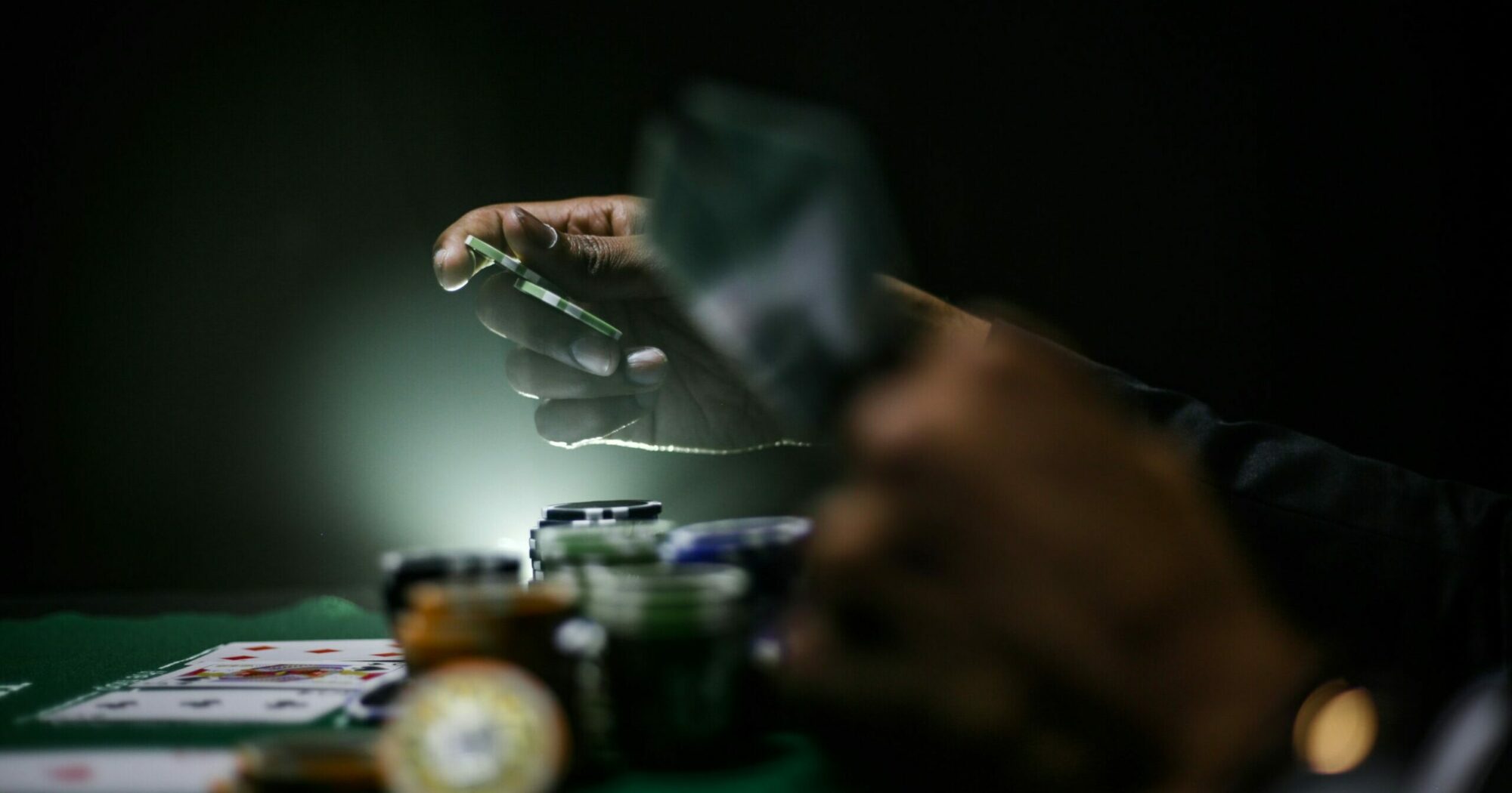 Man betting on a poker table