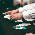 Multiple people playing baccarat