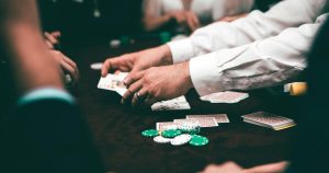 Multiple people playing baccarat