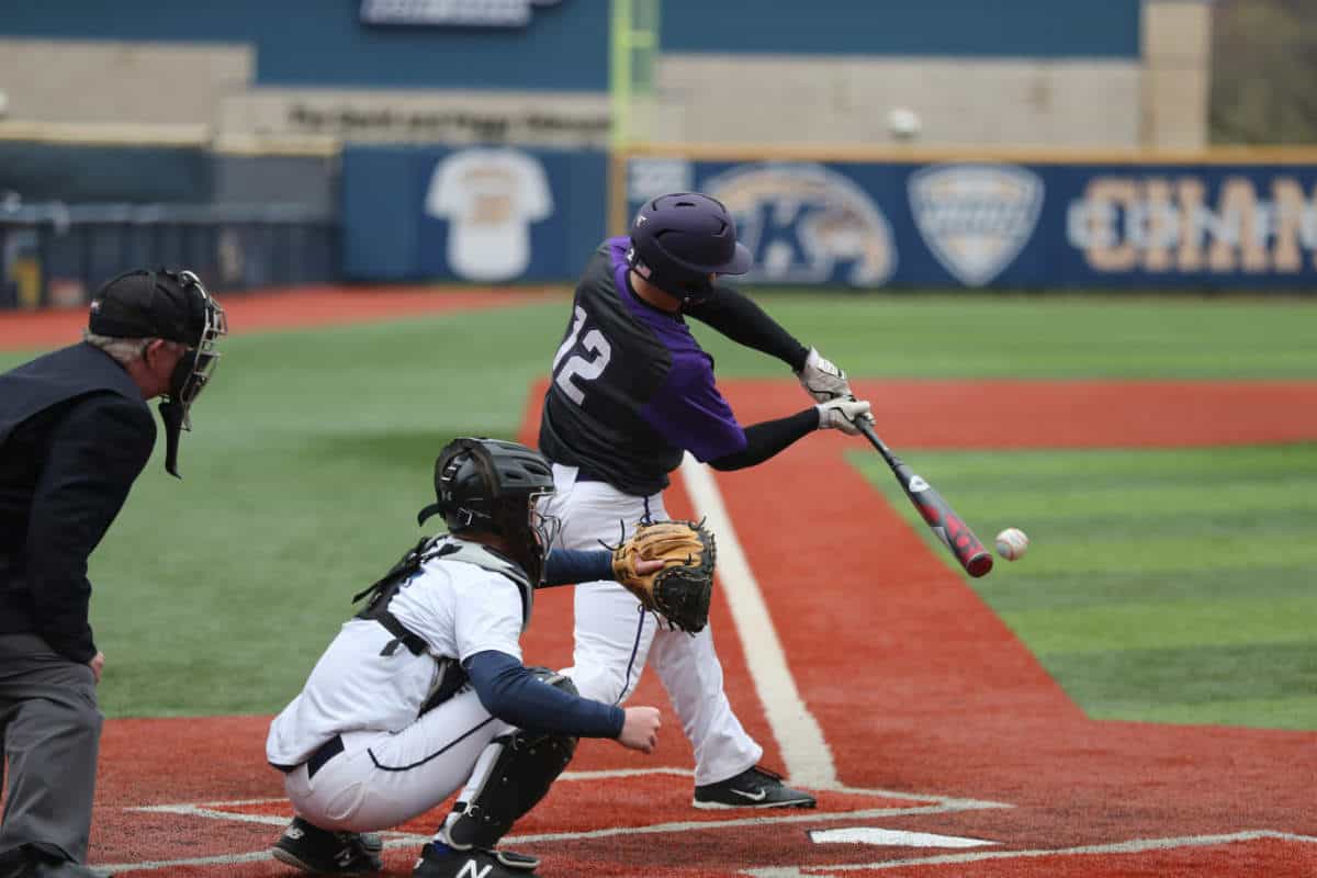 Man hitting a baseball