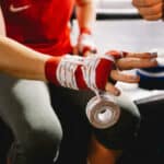 Man wrapping his hands before a fight
