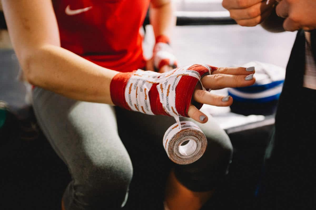Man wrapping his hands before a fight