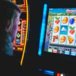 Man playing slot machines
