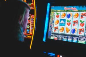 Man playing slot machines