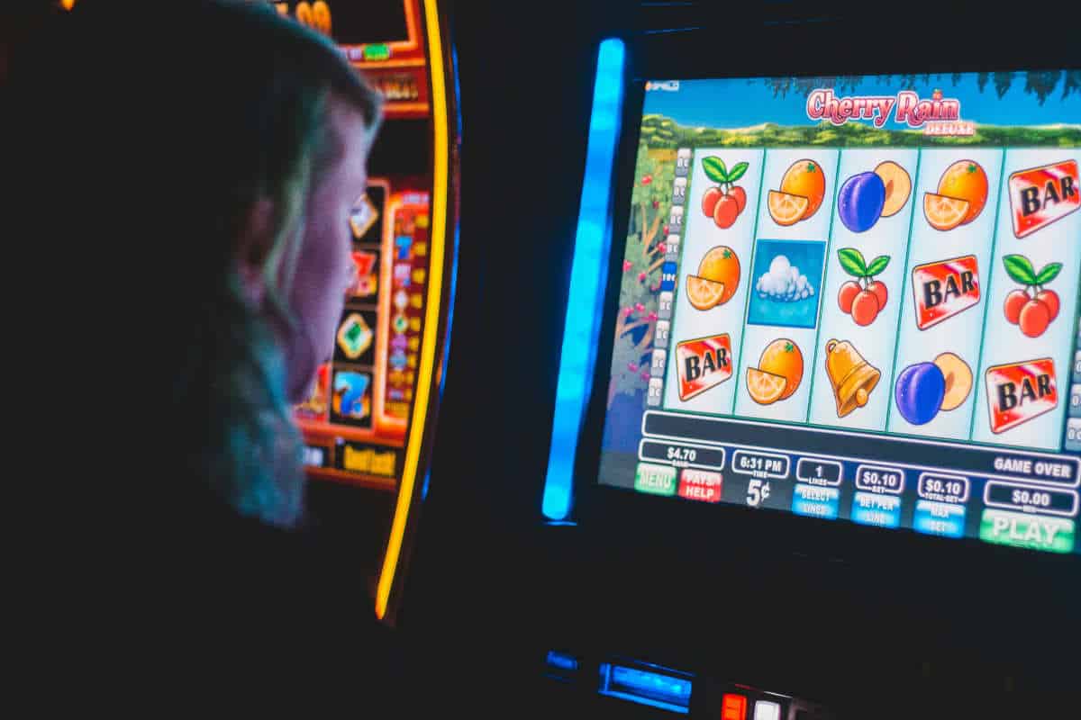 Man playing slot machines