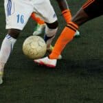 Football players battling for the ball
