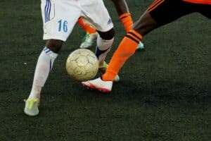 Football players battling for the ball