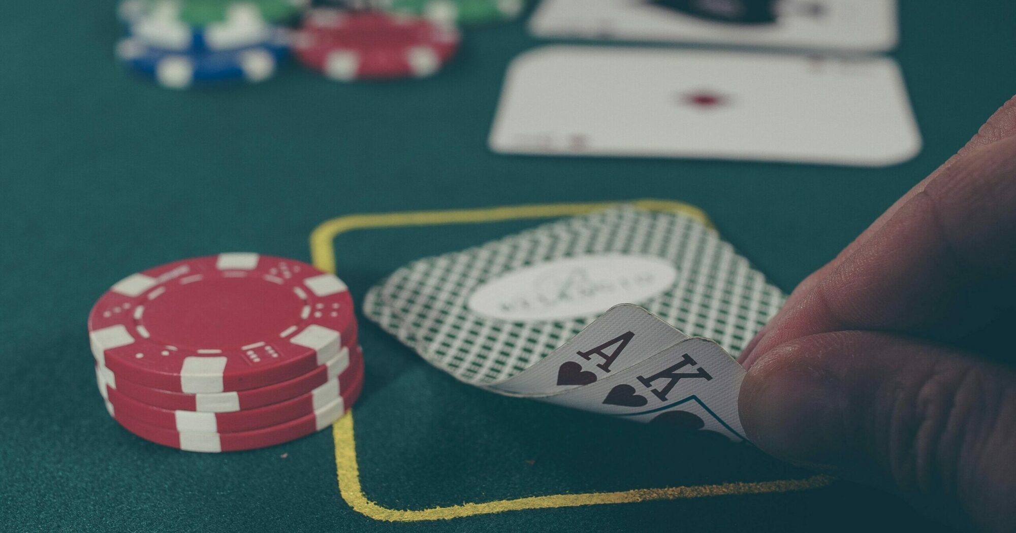 Man looking at his poker game hand