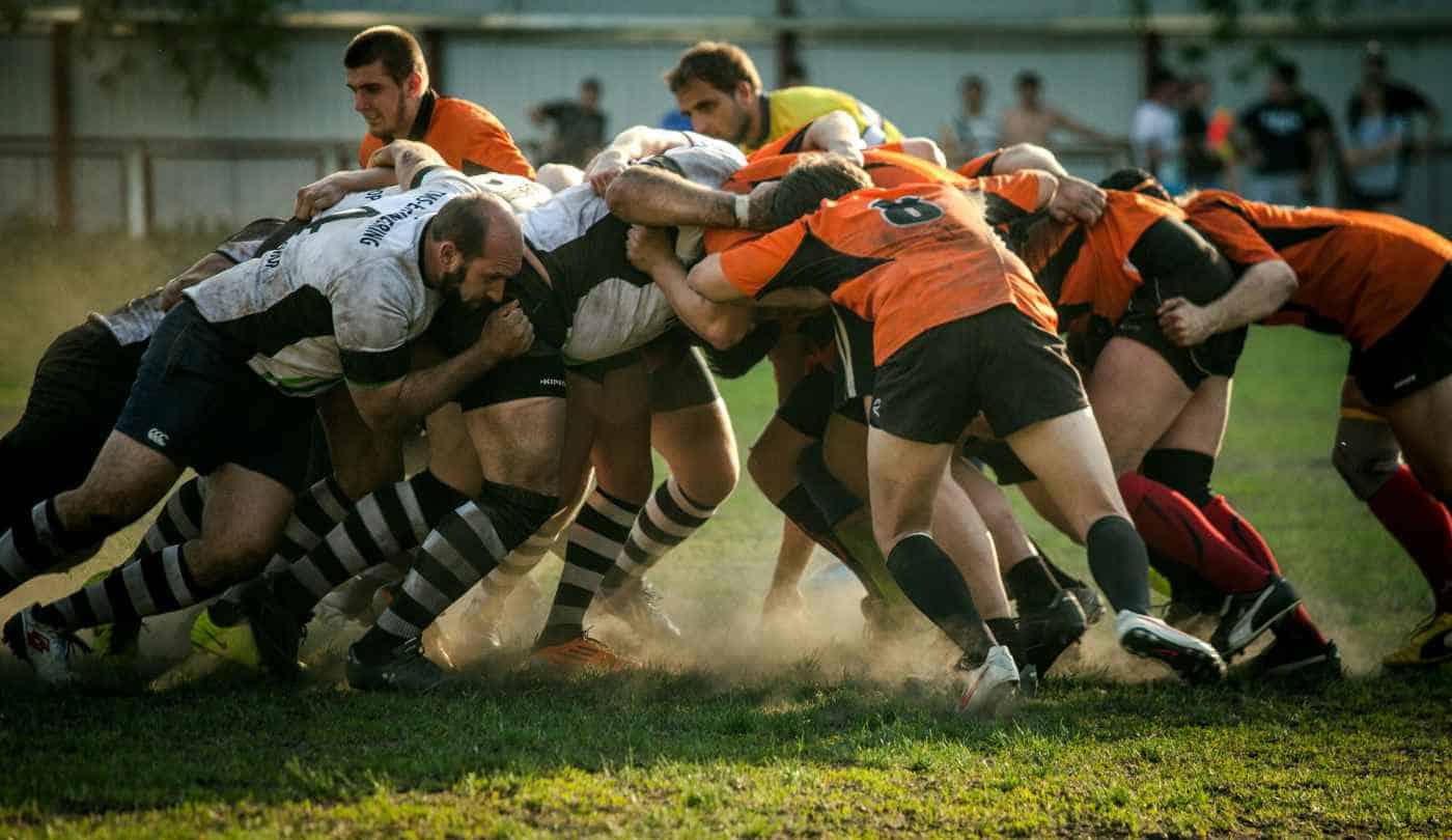 Two team fighting for a rugby ball
