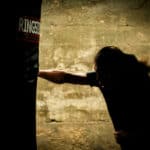 Man punching a boxing bag