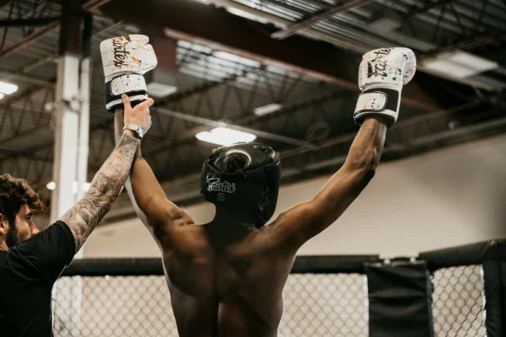 UFC fighter with his hands up in the ring