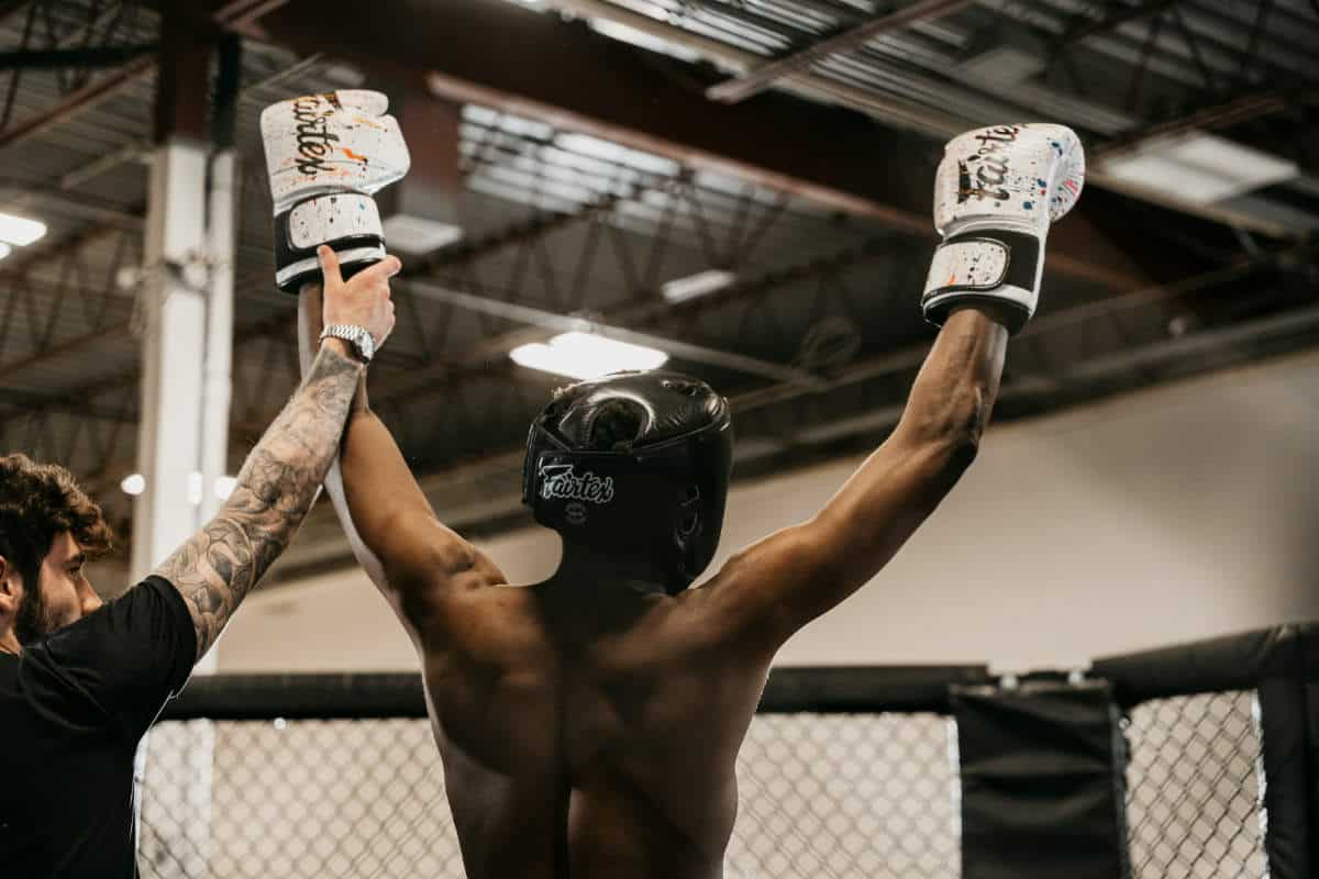 UFC fighter with his hands up in the ring