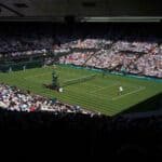 Tennis match filled with people in the stands