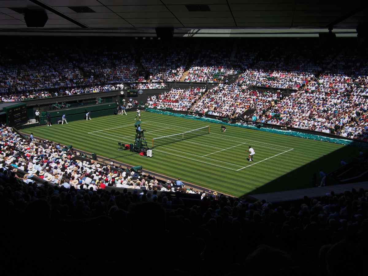 Tennis match filled with people in the stands