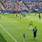 Football game in a stadium filled with people