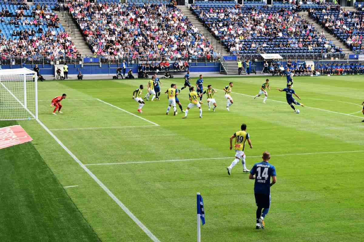 Football game in a stadium filled with people