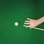 Man playing a game of snooker