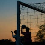 Goalkeeper catching the ball in the net