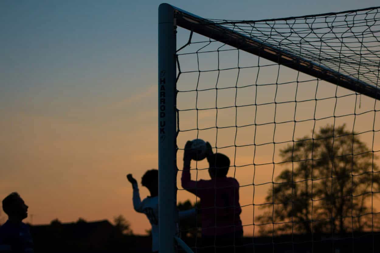 Goalkeeper catching the ball in the net