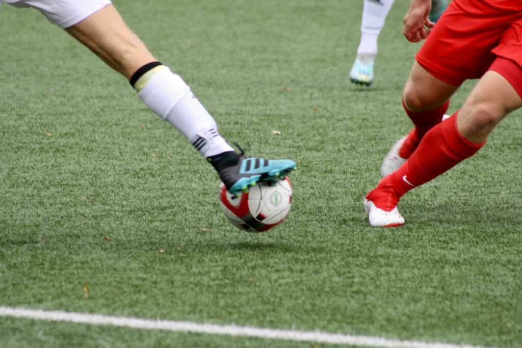 Two men playing football on the field