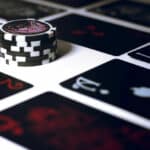 Chips with playing cards on table
