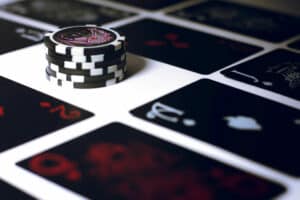 Chips with playing cards on table