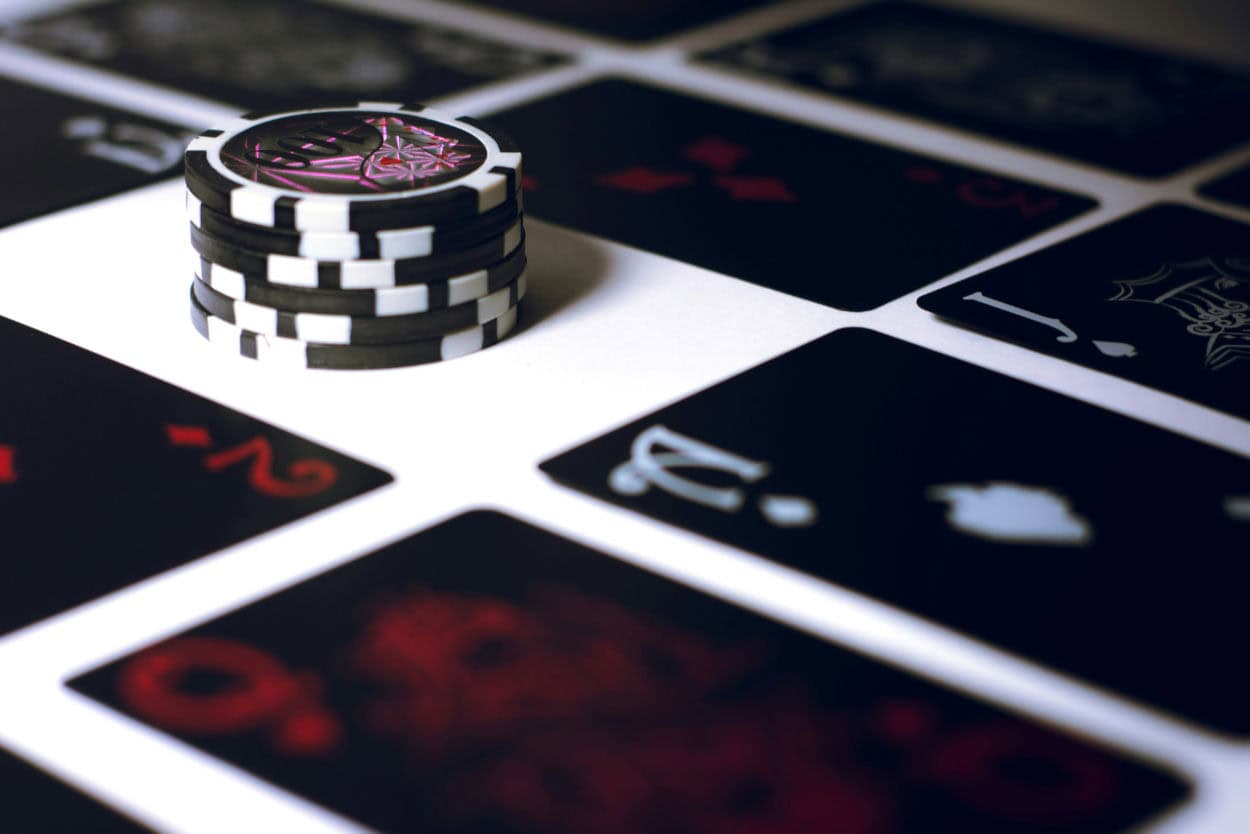 Chips with playing cards on table